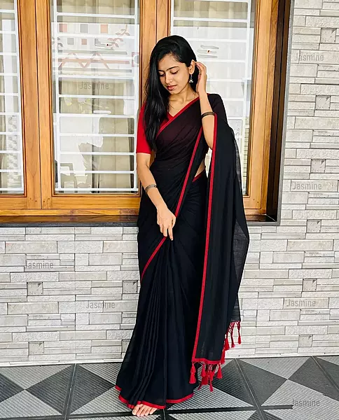 Lightweight black Mul Cotton saree with contrasting red border
