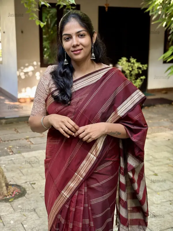 Brown Narayanpet cotton saree with horizontal woven stripes and silver border
