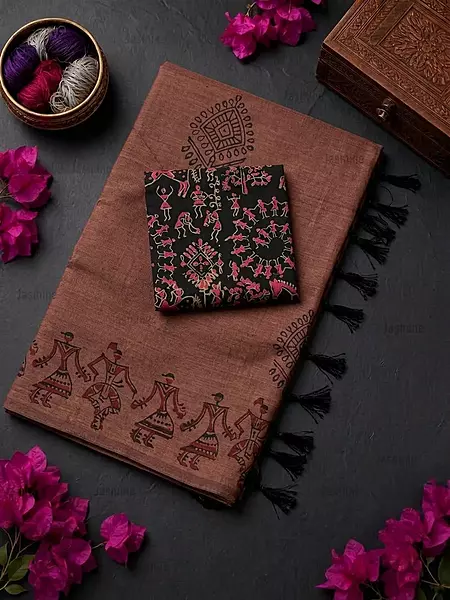 Dark cinnamon brown saree featuring distinctive Warli tribal art patterns
