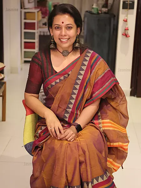 Terracotta dual-shade cotton saree featuring a distinctive spike-style temple border