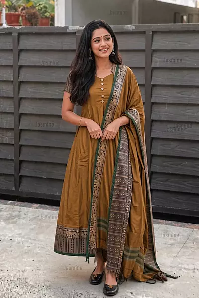 Mustard mercerised cotton dress material with elephant thread weaving