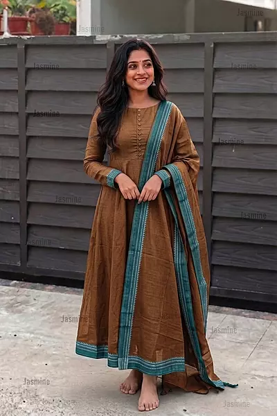 Plain mustard cotton dress material with a simple green border and matching dupatta