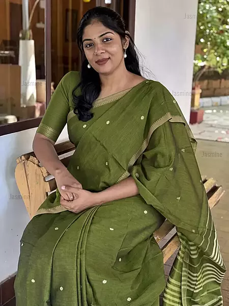 Olive green cotton saree with small butti and simple border