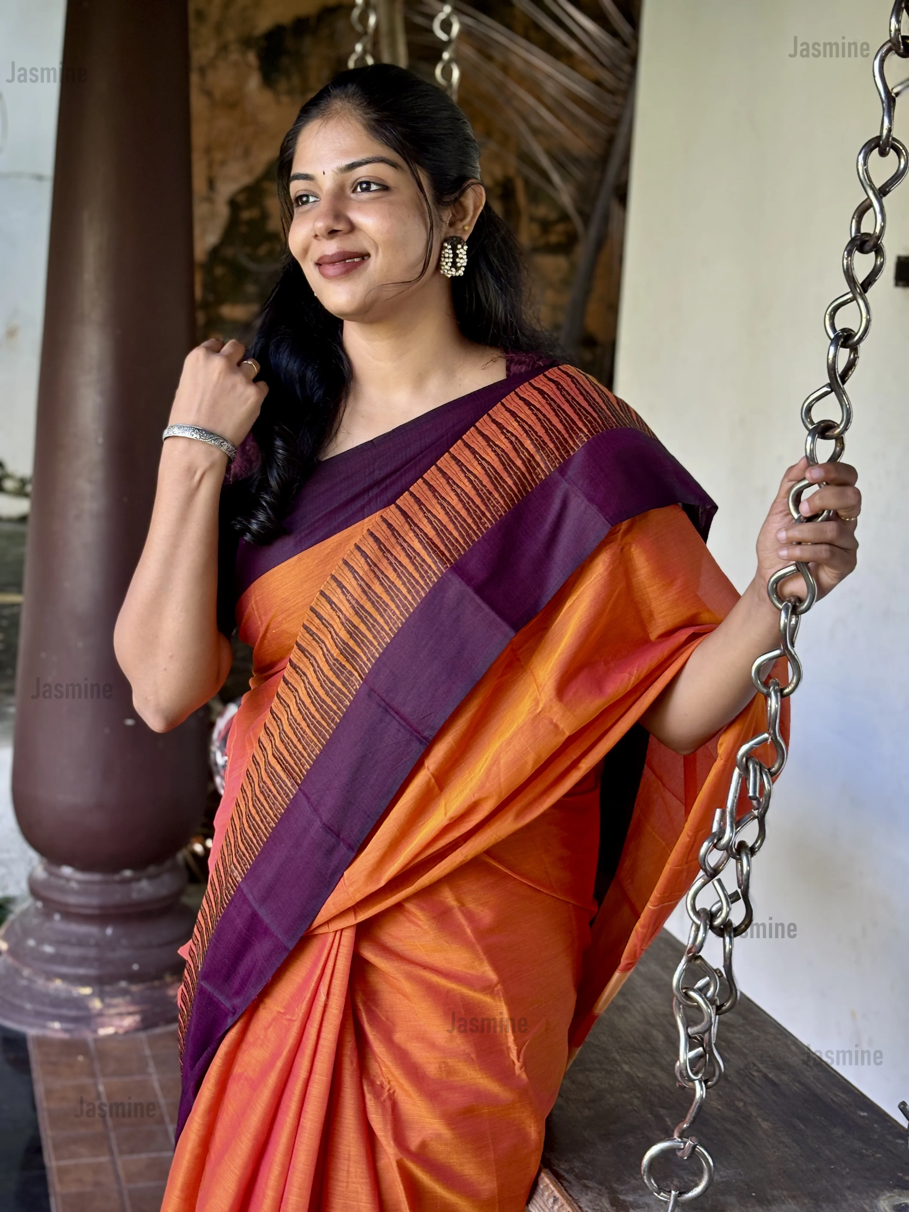 Orange Narayanpet cotton saree featuring a Deep Plum Temple and Spike border