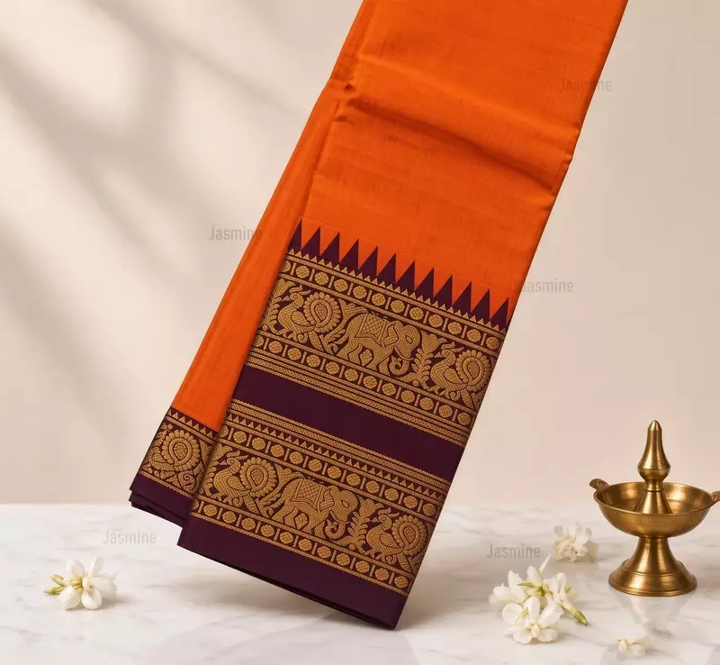 Orange Narayanpet cotton saree with elephant and peacock motifs