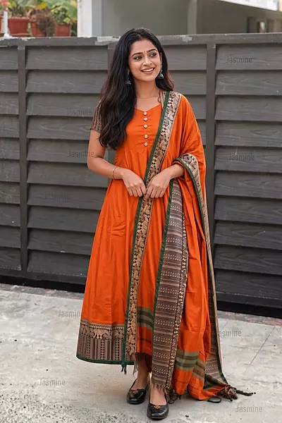 Orange mercerised cotton dress material with elephant thread weaving