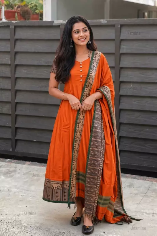 Orange mercerised cotton dress material with elephant thread weaving