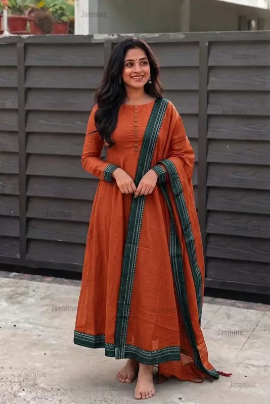 Plain orange cotton dress material with a simple green border and matching dupatta