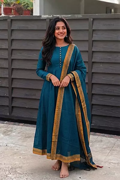 Plain peacock blue dress material with a simple mustard yellow contrast border