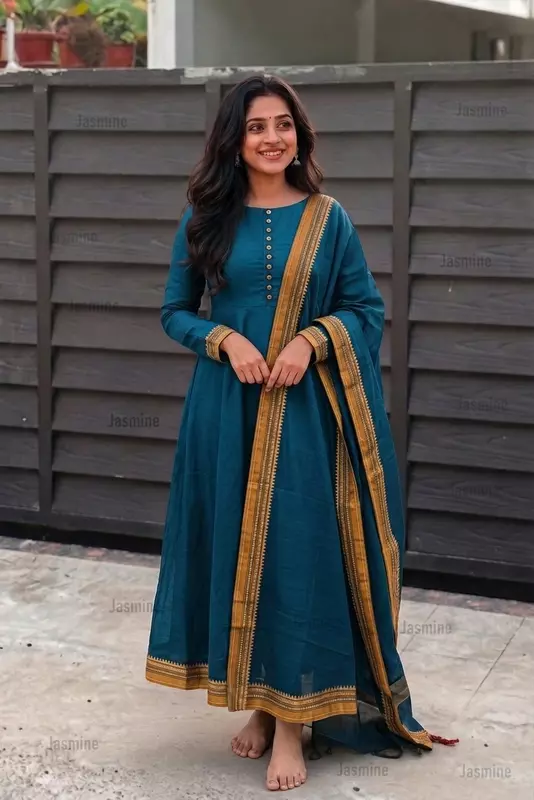 Plain peacock blue dress material with a simple mustard yellow contrast border
