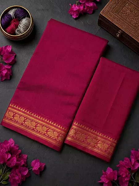 Pink plain saree with a matching peacock motif border along the edge