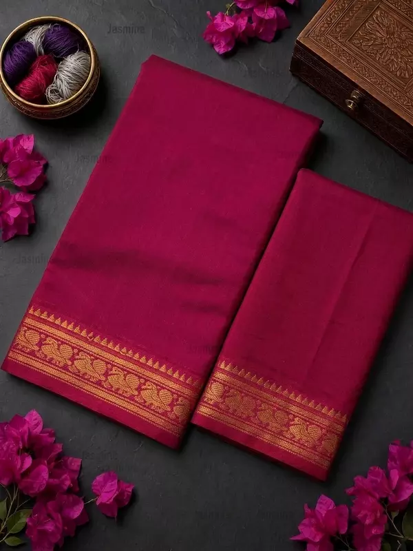 Pink plain saree with a matching peacock motif border along the edge