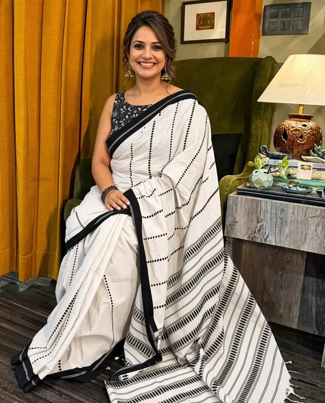 white Khadi cotton saree with woven thread detailing and black border