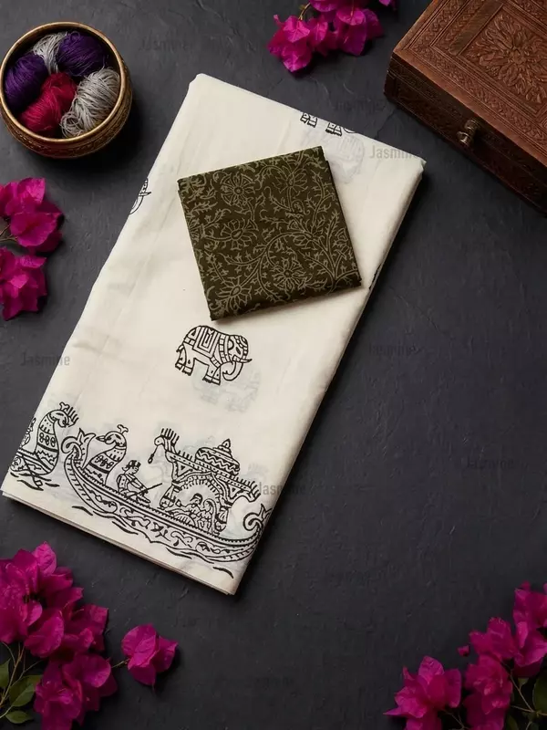 pure white cotton saree with elephant prints and boat-design border