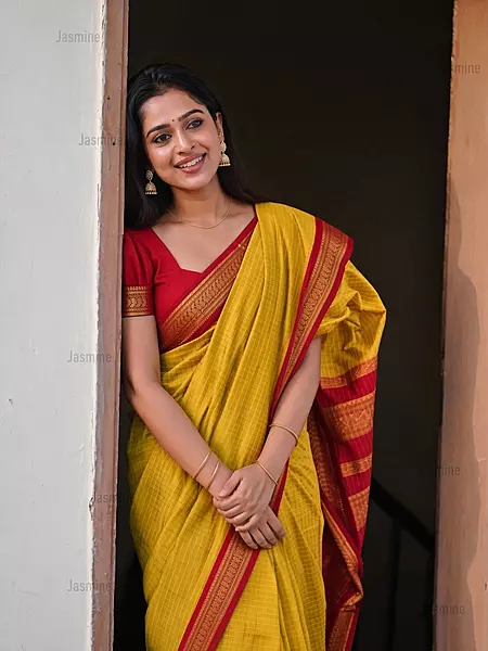 Yellow Gadwal checks saree with contrast red blouse