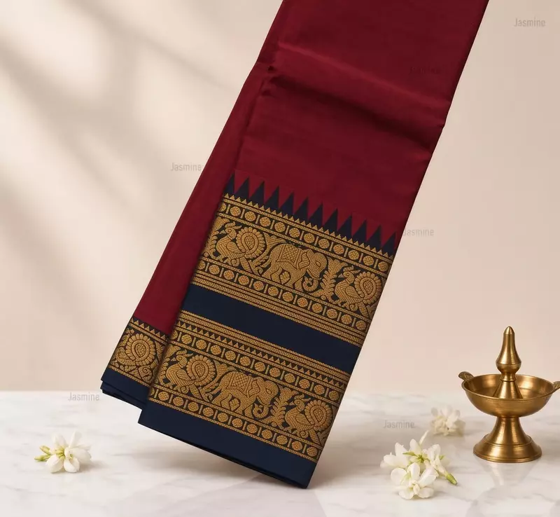 Maroon Narayanpet cotton saree with elephant and peacock motifs