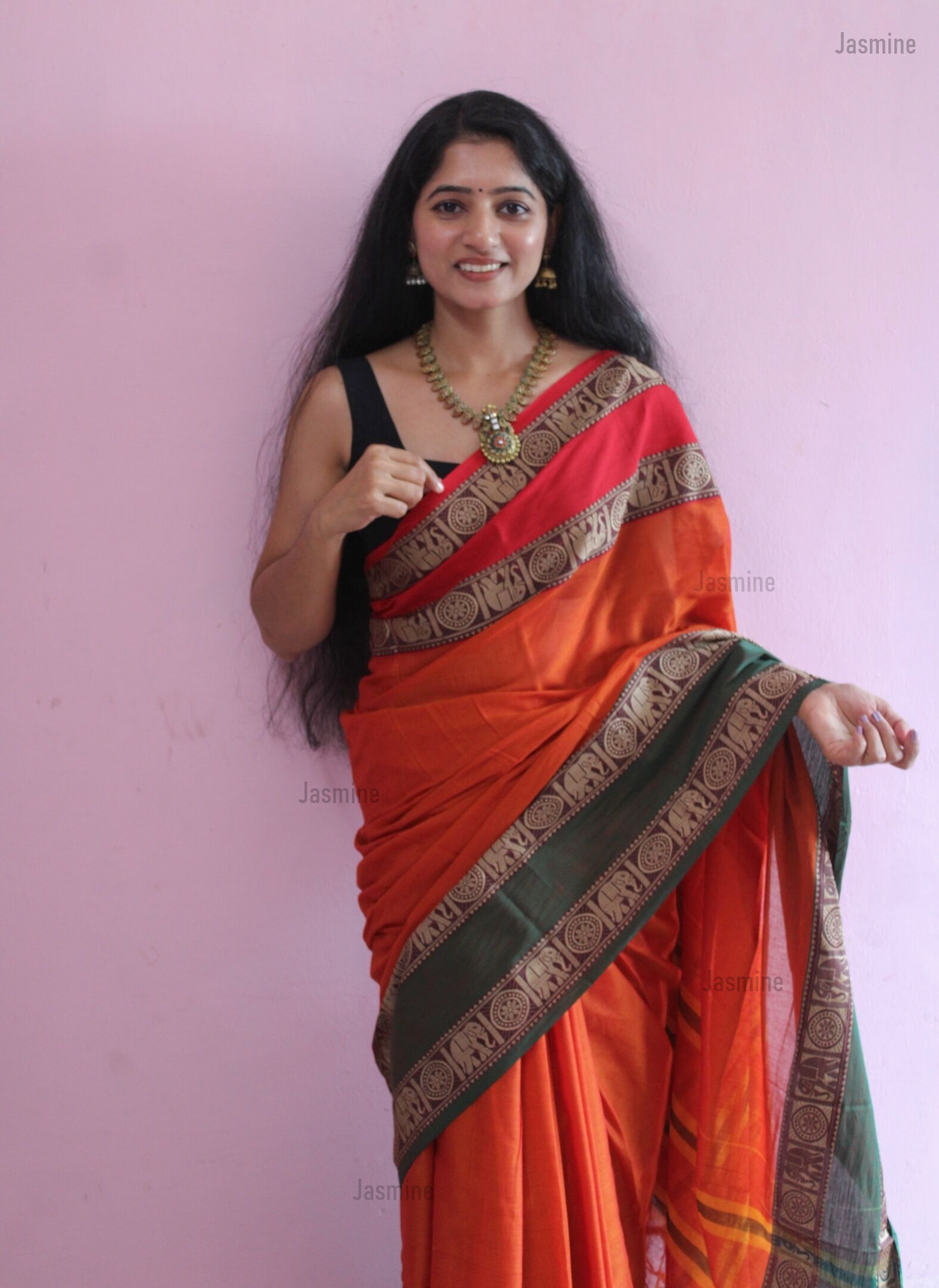 Meera traditional orange cotton saree with distinctive two-colour border
