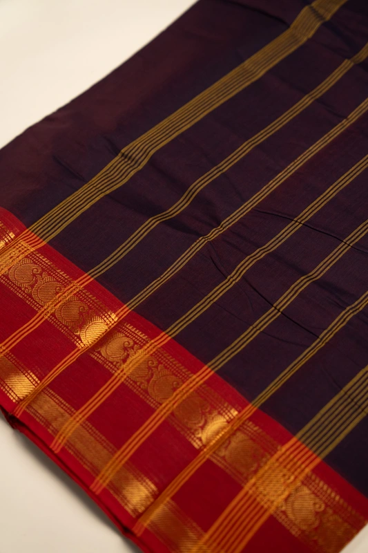 Kanchi Cotton plain body - Dark Purple with Broad Red Zari border on either side