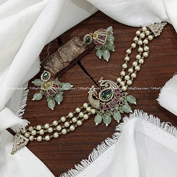 Pearl Choker With Peacock Design And Jumkas