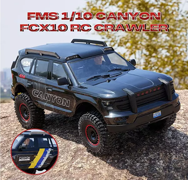 FMS Model 1: 10 Canyon RS Black front angle view with LED headlights illuminated