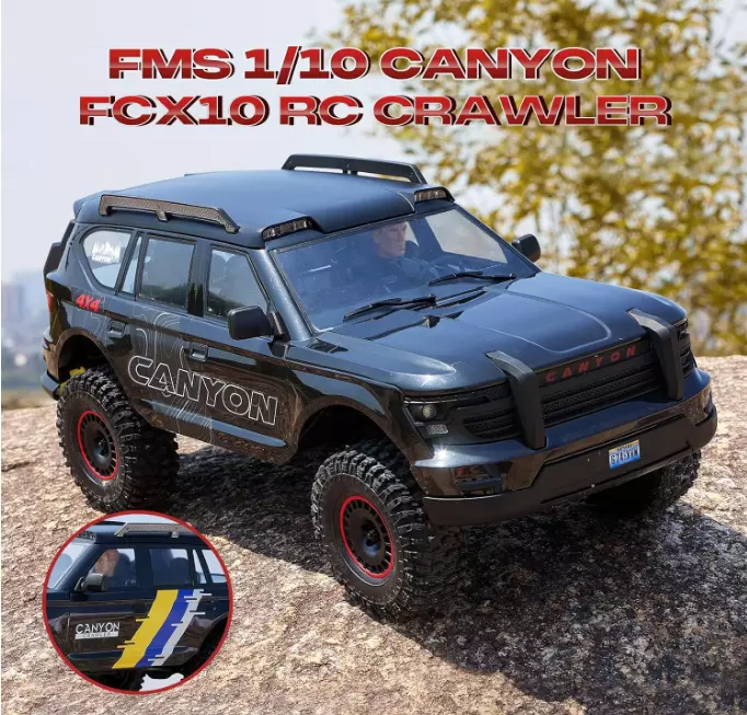 FMS Model 1: 10 Canyon RS Black front angle view with LED headlights illuminated