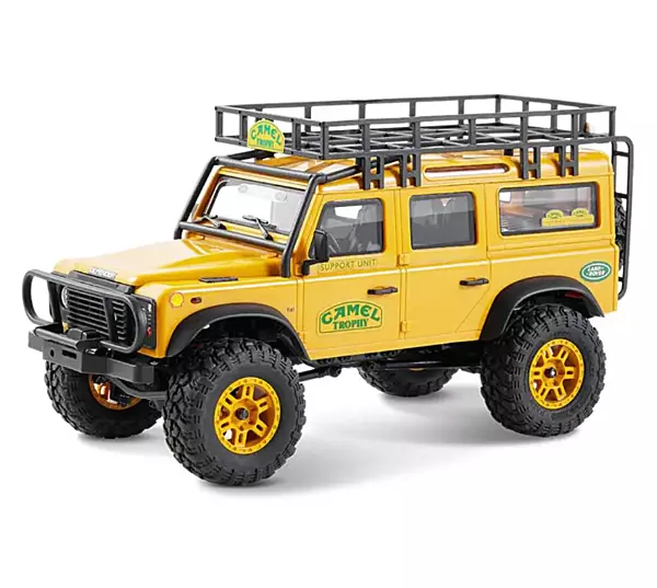 FMS Model 1: 24 Land Rover Defender 110 RTR Yellow front angle view on rock obstacle