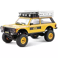 FMS Model 1: 24 Range Rover 1st- Generation RTR Yellow front angle view on rock obstacle