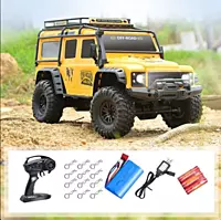 Rear suspension articulation and coil-spring shock detail on Discovery Yellow