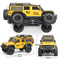 Close-up of front grille, headlights, and scale details on yellow Discovery