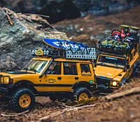 FMS Model 1:24 Land Rover Defender 90 RTR Yellow climbing outdoor garden rocks