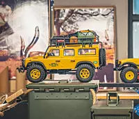 Multi-link suspension articulation view on FMS Model 1:24 Land Rover Defender 90 RTR Yellow