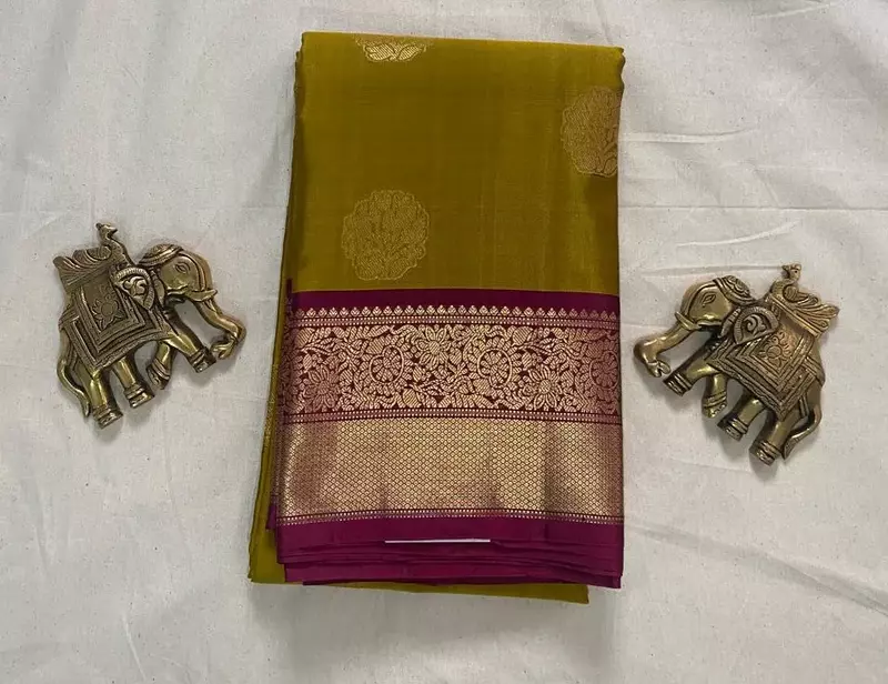 Olive green silk saree with cranberry zari border
