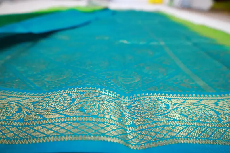 Mint Green and blue (double color) silk saree with teal zari border