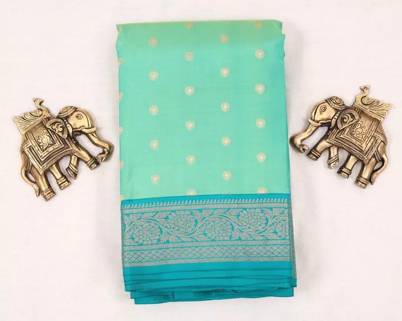 Mint Green and blue (double color) silk saree with teal zari border