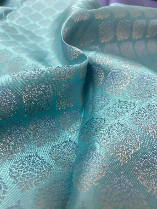 Aqua blue silk saree with sky blue zari pallu and floral zari border