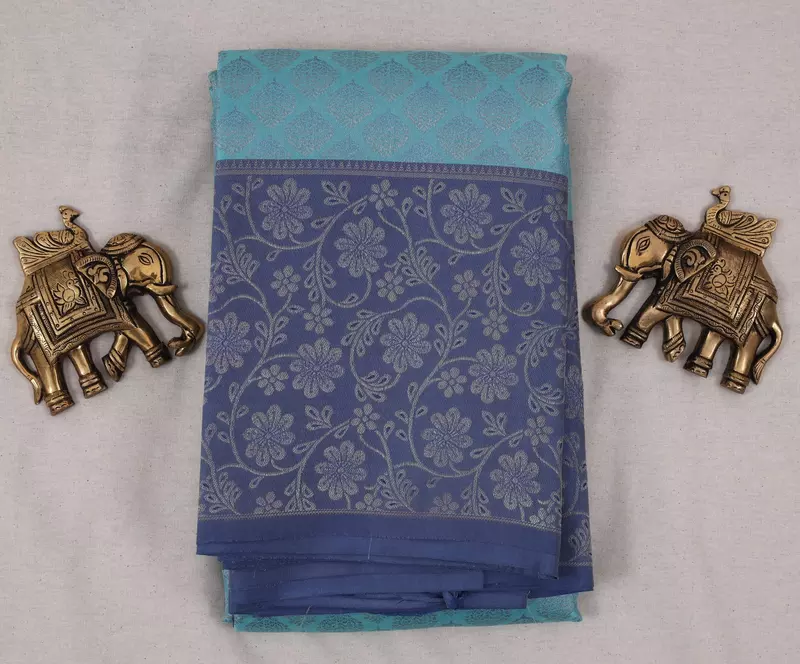 Aqua blue silk saree with sky blue zari pallu and floral zari border