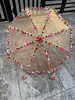 Umbrella with artificial flowers