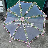 Umbrella with artificial flowers