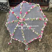 Umbrella with artificial flowers