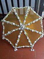 Umbrella with artificial flowers