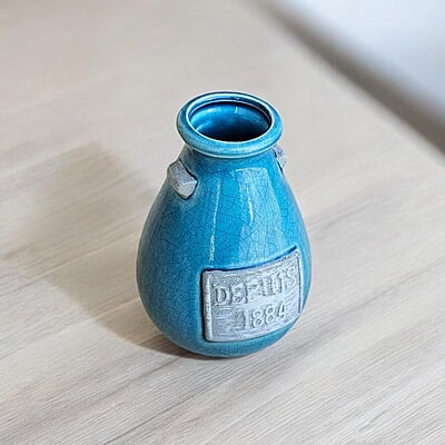 Blue Ceramic Vase with "Depuis 1884" Detail