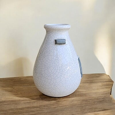 hite Ceramic Vase with "Depuis 1884" Detail