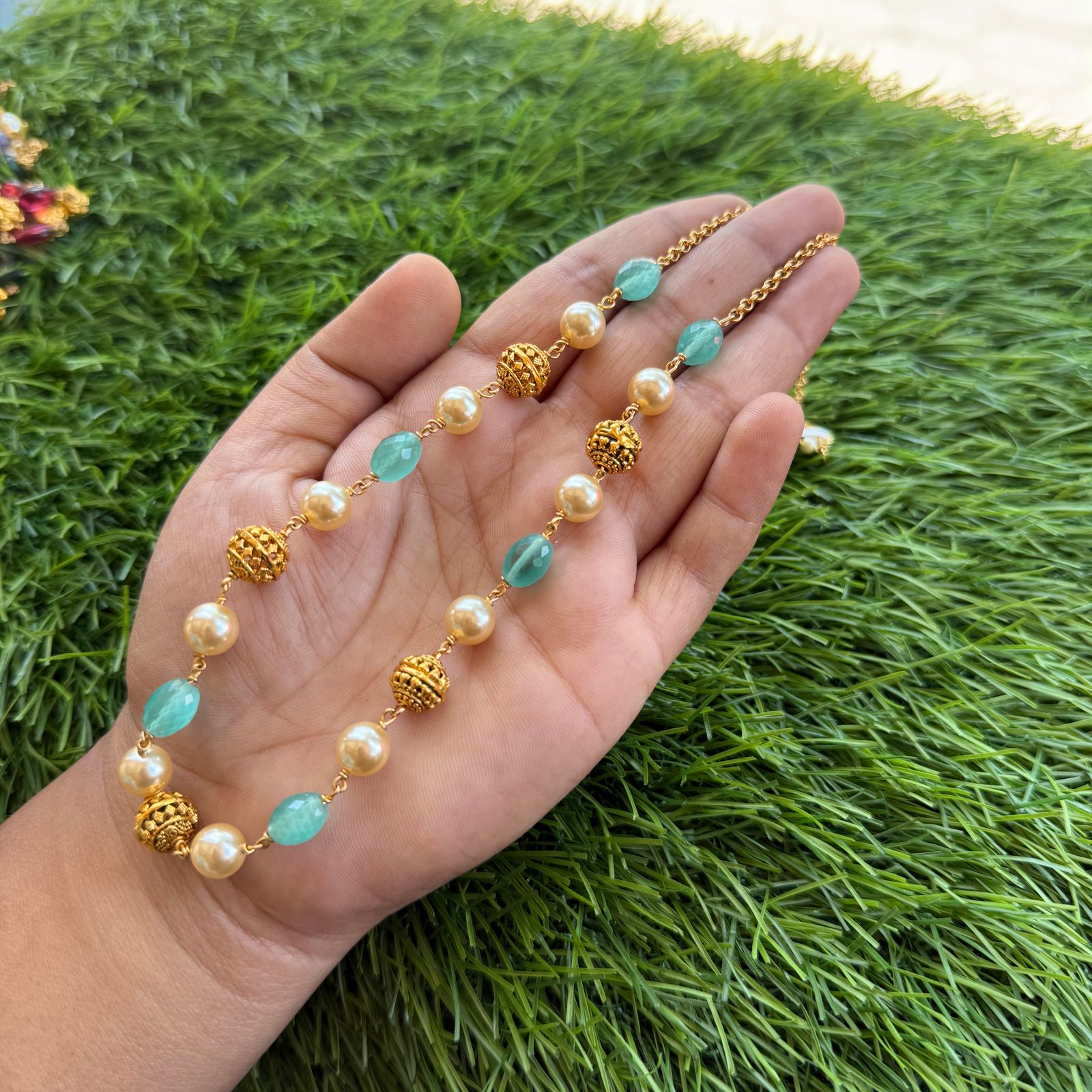 gold and off white pearl chain