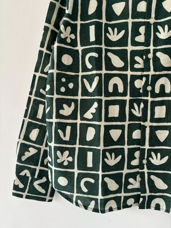 Green and white printed shirt