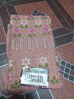 Siroski Stones Saree Cream Colour With Maggam Work Blouse