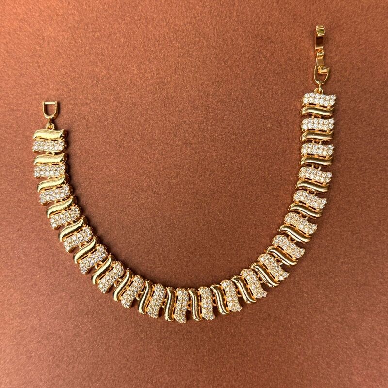 Four petal flower with black enamal design gold bracelet