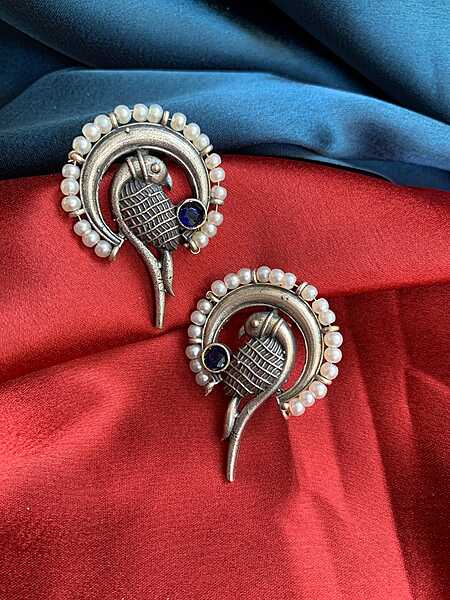 Exotic Parrot Motif Oxidized Silver Studs with Pearl & Blue Stone Exotic Parrot Motif Oxidized Silver Studs with Pearl & Blue Stone