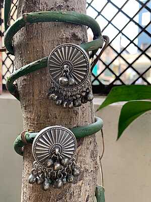 Celestial Sunburst Oxidized Silver Studs with Cascading Ghungroo Droplets Celestial Sunburst Oxidized Silver Studs with Cascading Ghungroo Droplets