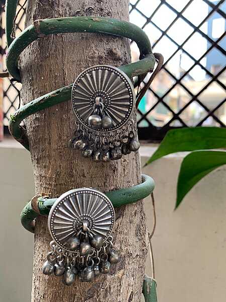 Celestial Sunburst Oxidized Silver Studs with Cascading Ghungroo Droplets Celestial Sunburst Oxidized Silver Studs with Cascading Ghungroo Droplets