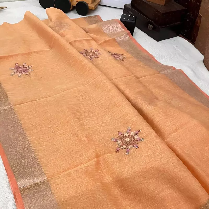 Peach-Orange Tissue Linen Saree with Intricate French Knot Embroidery and Zari Borders